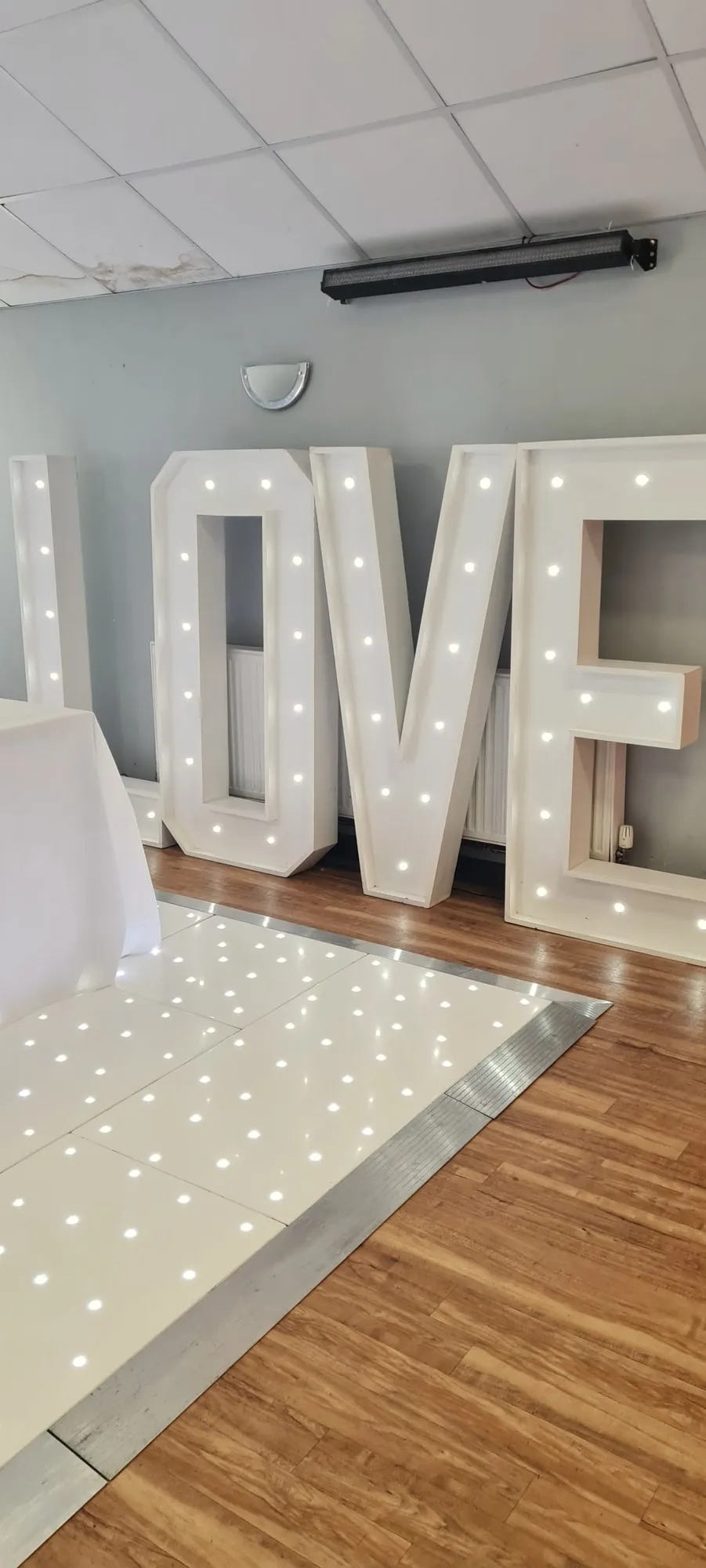 Light-up LOVE letters beside the dancefloor