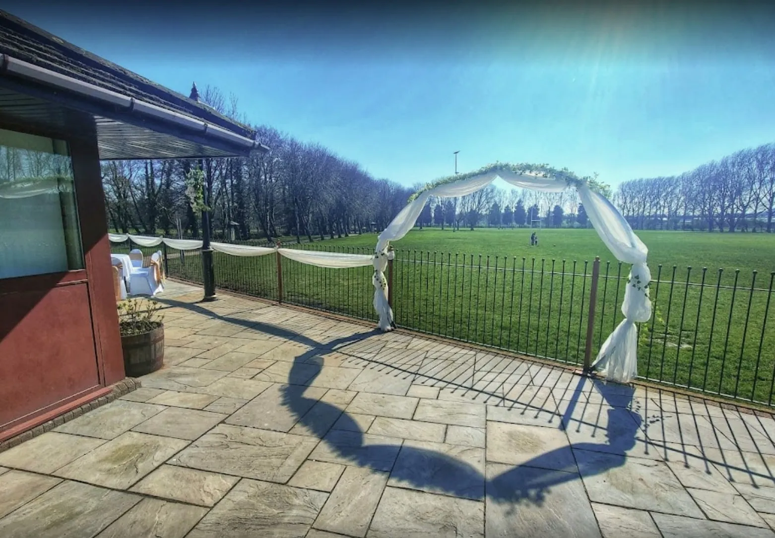 Draped arch on the patio facing the fields