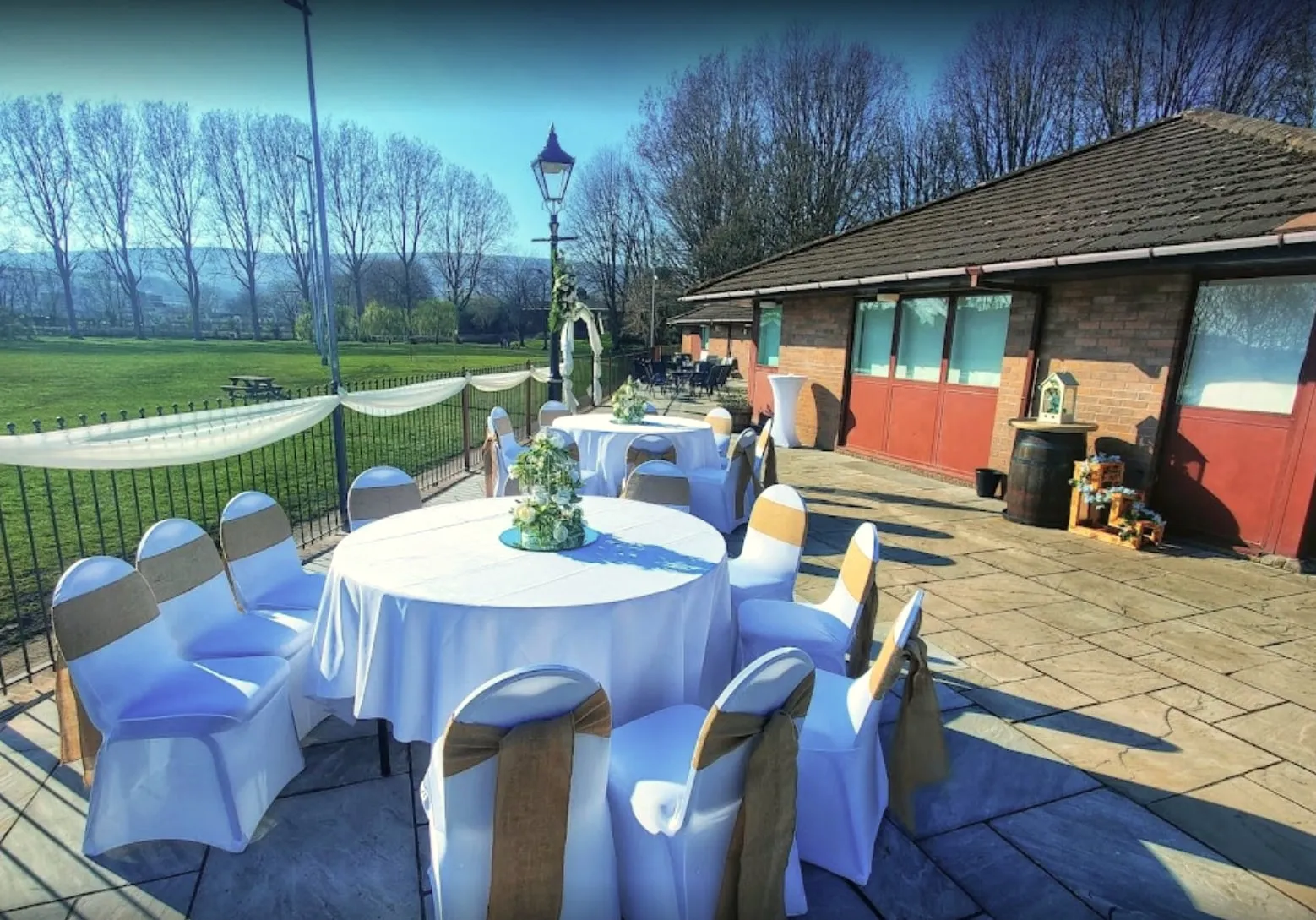 Dressed tables on the patio beside the venue