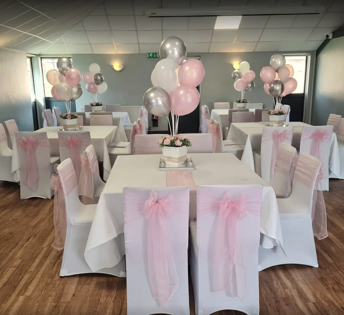 Tables dressed in pink with balloon centrepieces